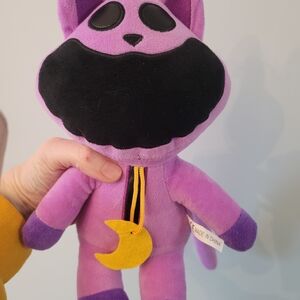 Purple Plush Toy with Black Details